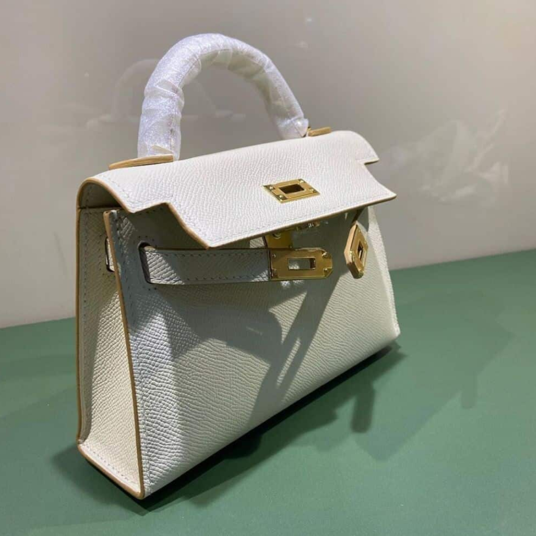 HERMÈS KELLY 20 BAG WITH GOLD HARDWARE IN OFF-WHITE