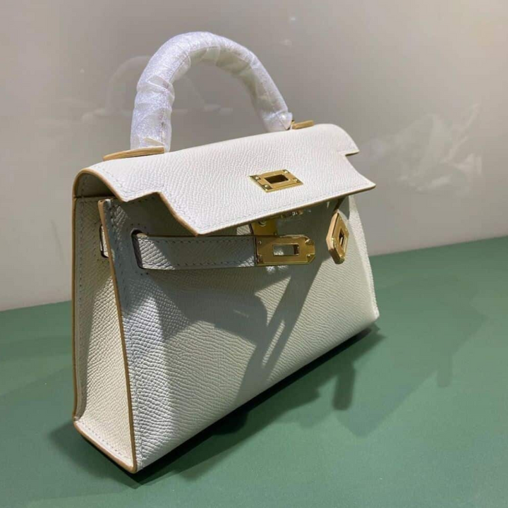 HERMÈS KELLY 20 BAG WITH GOLD HARDWARE IN OFF-WHITE